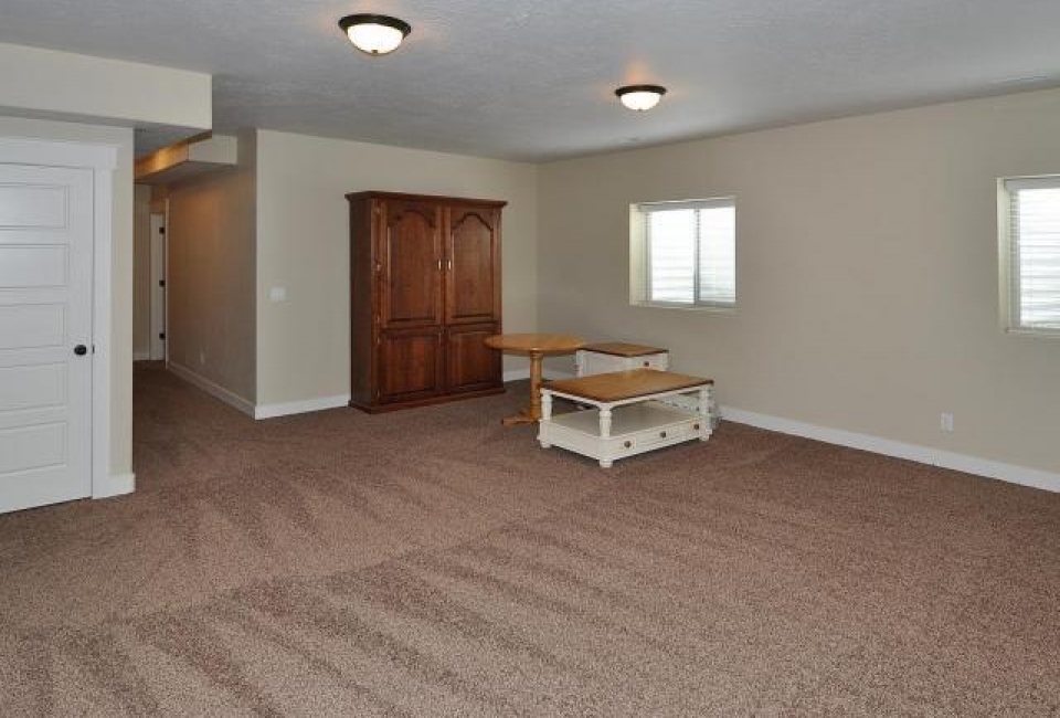 basement family room in home on Martings Dr. in Daybreak